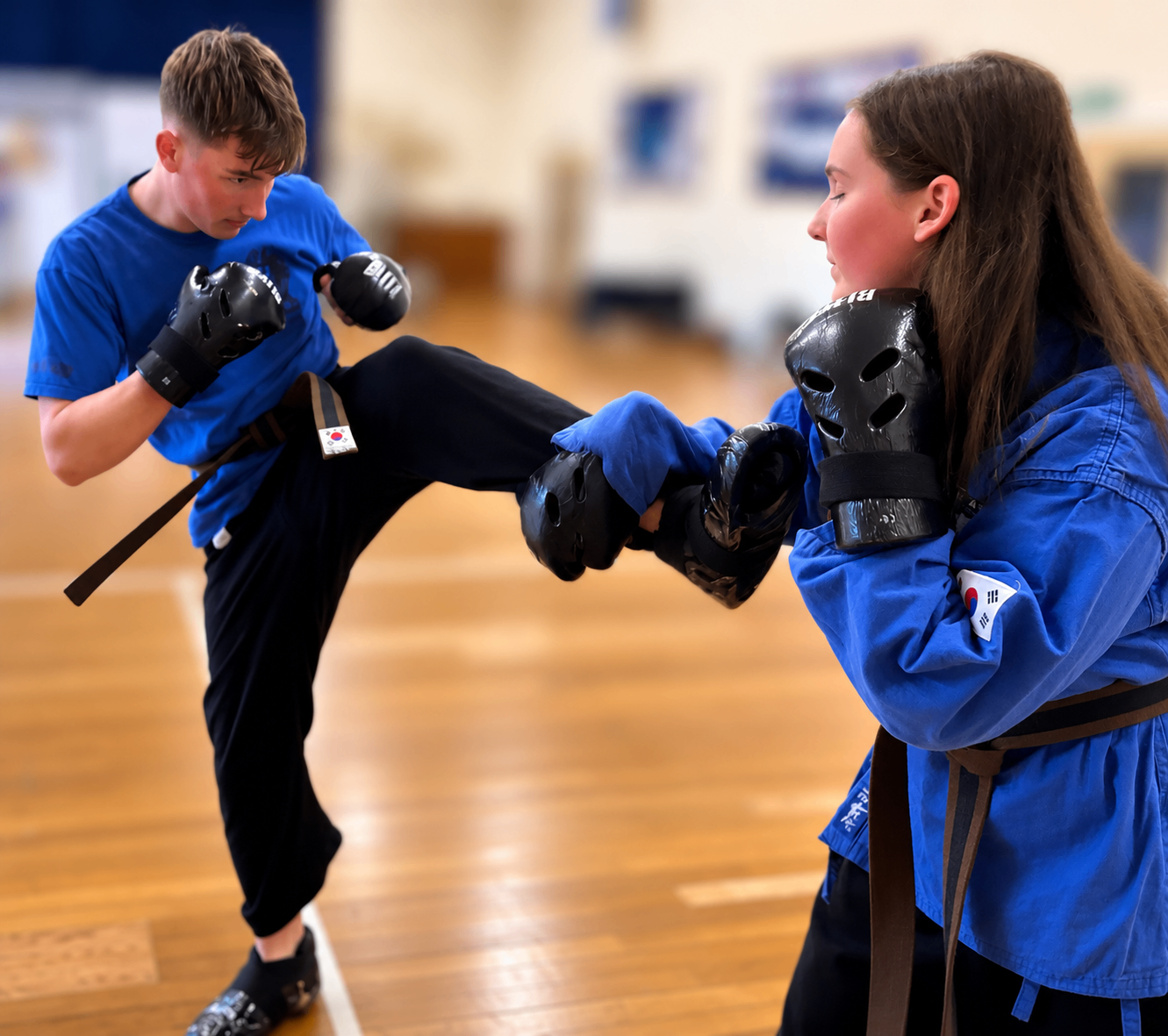 Teenagers training together in a martial arts class